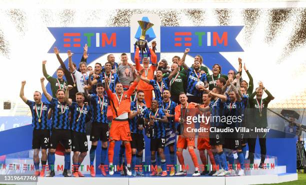 Players and staff of FC Internazionale celebrate withthe trophy for the victory of nineteenth "scudetto" at the end of the last Serie A match between...