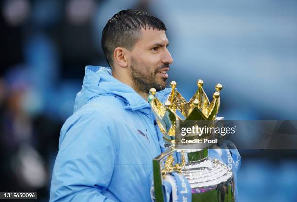 Sergio Aguero of Manchester City celebrates with the Premier League Trophy as Manchester City are presented with the Trophy as they win the league...