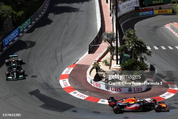 Max Verstappen of the Netherlands driving the Red Bull Racing RB16B Honda leads Valtteri Bottas of Finland driving the Mercedes AMG Petronas F1 Team...