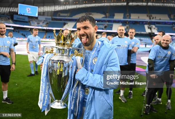 Sergio Aguero of Manchester City celebrates with the Premier League Trophy as Manchester City are presented with the Trophy as they win the league...