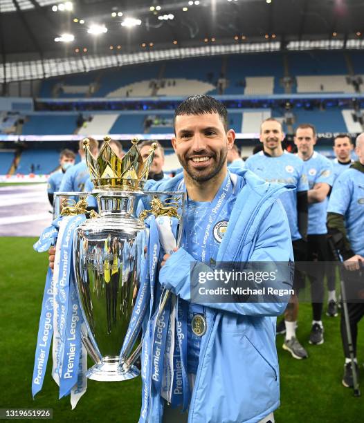 Sergio Aguero of Manchester City celebrates with the Premier League Trophy as Manchester City are presented with the Trophy as they win the league...