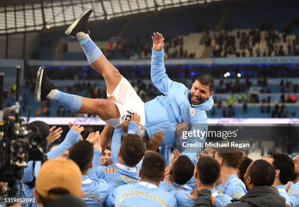 Sergio Aguero of Manchester City is thrown into the air by his teammates after playing his last game for Manchester City following the Premier League...