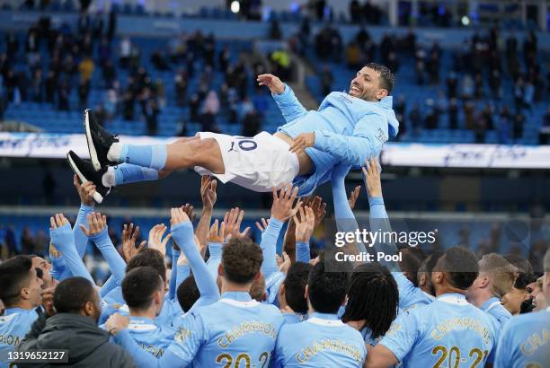Sergio Aguero of Manchester City is thrown into the air by his teammates after playing his last game for Manchester City following the Premier League...