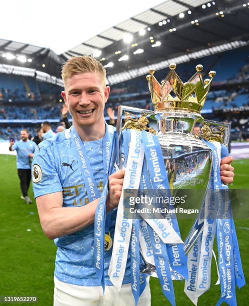 Kevin De Bruyne of Manchester City celebrates with the Premier League Trophy as Manchester City are presented with the Trophy as they win the league...