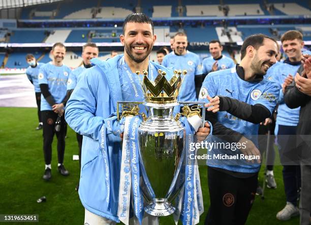 Sergio Aguero of Manchester City celebrates with the Premier League Trophy as Manchester City are presented with the Trophy as they win the league...