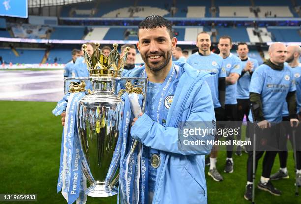 Sergio Aguero celebrates with the Premier League Trophy as Manchester City are presented with the Trophy as they win the league following the Premier...