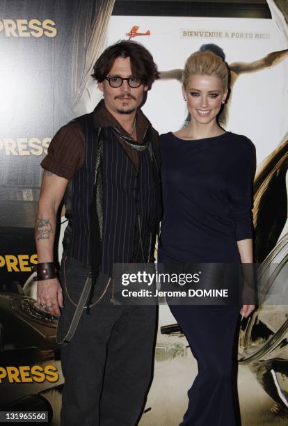 Johnny Depp and Amber Heard attend the 'Rhum Express' Paris Premiere at Cinema Gaumont Marignan on November 8, 2011 in Paris, France.