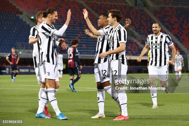 Federico Chiesa of Juventus celebrates with team mates after scoring to give the side a 1-0 lead during the Serie A match between Bologna FC and...