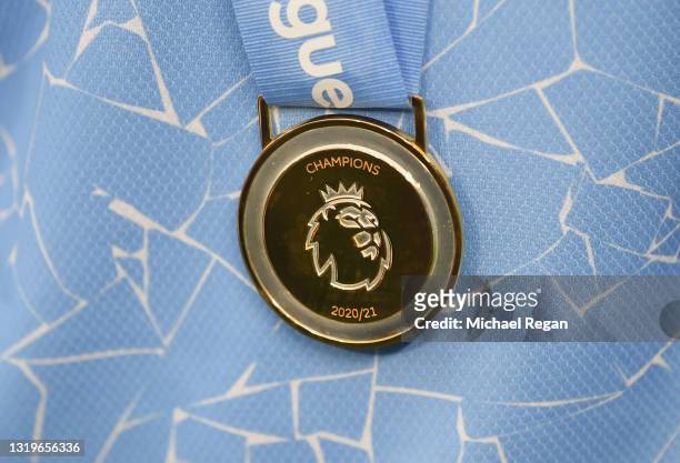 Detailed view of a Premier League 2020/21 Winners medal is seen as Manchester City are presented with the the Premier League Trophy as they win the...