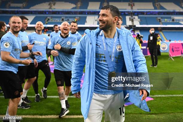 Sergio Aguero of Manchester City looks on after Manchester City are presented with the Trophy as they win the league following the Premier League...