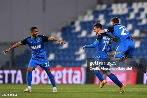 Georgios Kyriakopoulos of U.S. Sassuolo Calcio celebrates with team mates Jeremy Toljan and Domenico Berardi after scoring his team's first goal...