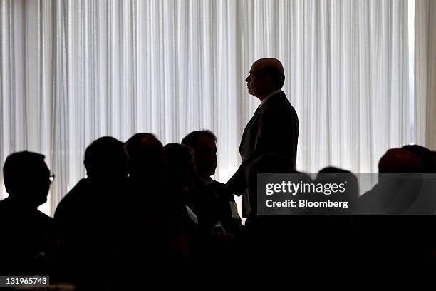 Ben S. Bernanke, chairman of the U.S. Federal Reserve, leaves after speaking at a small business and entrepreneurship conference in Washington, D.C.,...