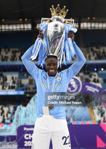 Benjamin Mendy of Manchester City celebrates with the Premier League Trophy as Manchester City are presented with the Trophy as they win the league...