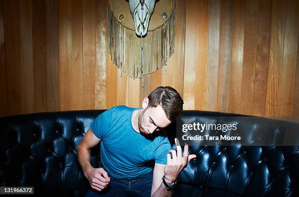 young man playing air guitar - air guitar stock pictures, royalty-free photos & images