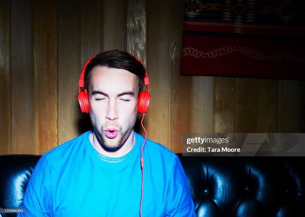 Young man listening to music wearing headphones