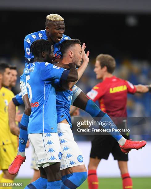 Amir Rrahmani of SSC Napoli celebrates with team mates Tiemoue Bakayoko and Victor Osimhen after scoring his team's first goal during the Serie A...