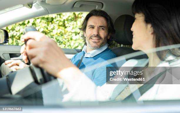business couple talking while sitting in car - conversation car bildbanksfoton och bilder