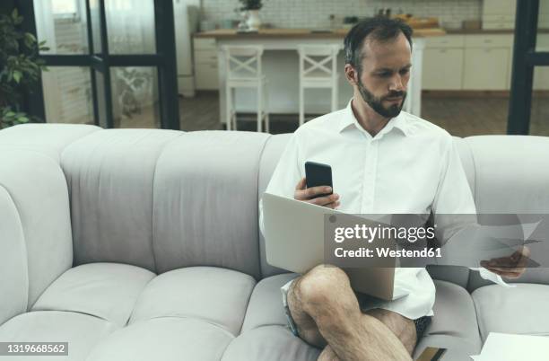 businessman working at home - semi dress fotografías e imágenes de stock