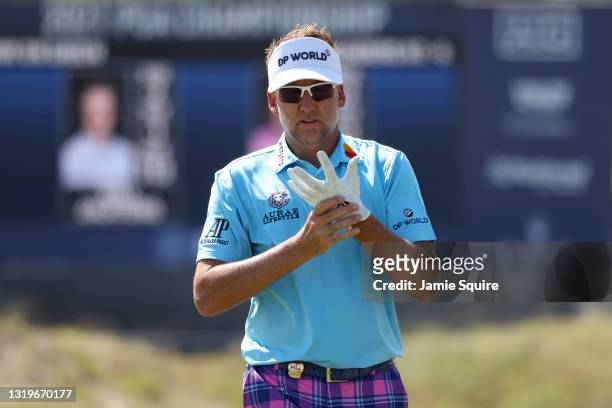 Ian Poulter of England adjusts his glove on the 16th hole during the final round of the 2021 PGA Championship held at the Ocean Course of Kiawah...
