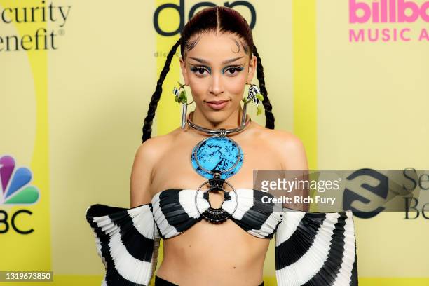 In this image released on May 23, Doja Cat poses backstage for the 2021 Billboard Music Awards, broadcast on May 23, 2021 at Microsoft Theater in Los...