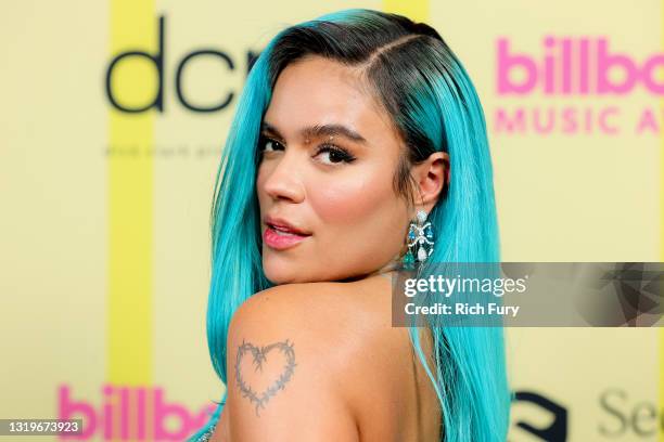 In this image released on May 23, Karol G poses backstage for the 2021 Billboard Music Awards, broadcast on May 23, 2021 at Microsoft Theater in Los...