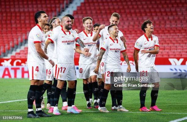 Alejandro Papu Gomez of Sevilla FC celebrates scoring a goal with team mates during the La Liga Santander match between Sevilla FC and Deportivo...