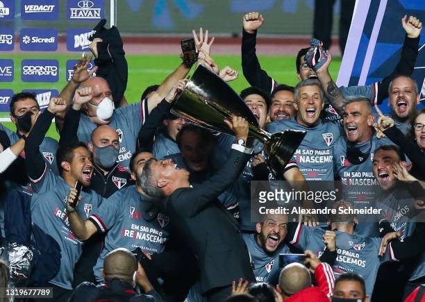 Hernan Crespo, head coach of Sao Paulo lifts the champion trophy after winning the second leg final match between Sao Paulo and Palmeiras as part of...