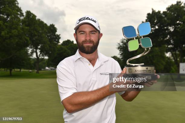 Cameron Young holds the trophy after winning the AdventHealth Championship at Blue Hills Country Club on May 23, 2021 in Kansas City, Missouri. Young...