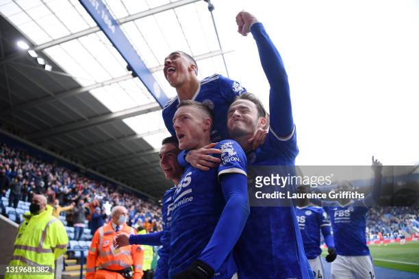 Jamie Vardy of Leicester City celebrates with teammate James Maddison and Youri Tielemans after scoring his team's second goal during the Premier...