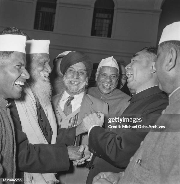 Premier of the People's Republic of China Zhou Enlai , wearing a Zhongshan suit in conversation unspecified Indian politicians during a visit to the...