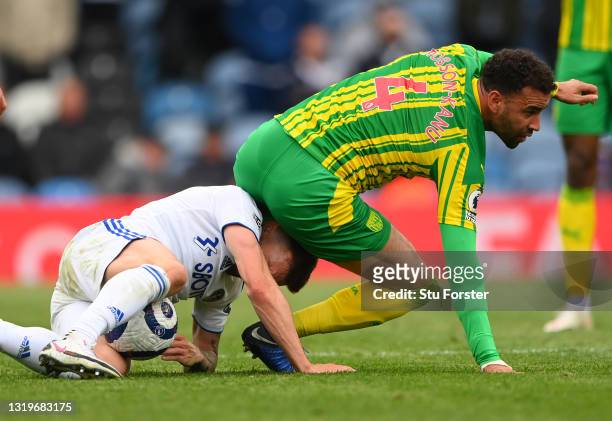 Player Hal Robson-Kanu ends up sitting on top of Stuart Dallas of Leeds during the Premier League match between Leeds United and West Bromwich Albion...