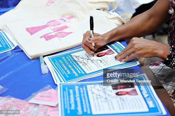 Olympic Athlete Dominique Dawes signs autographs during the free diabetes testing at the Bellevue Hospital Center Atrium on November 9, 2011 in New...