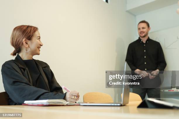 portrait of english teacher give a lecture - japanese people lesson english stock pictures, royalty-free photos & images