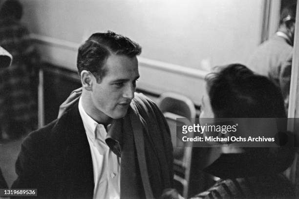 American actor Paul Newman speaking to an unspecified woman, her back to the camera, at the Actors Studio in the Manhattan borough of New York City,...