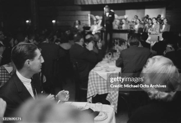 View from among the guests applauding an unspecified performer at Birdland, a jazz club in the borough of Manhattan, New York City, New York, circa...