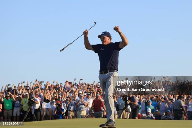 Phil Mickelson of the United States celebrates on the 18th green after winning during the final round of the 2021 PGA Championship held at the Ocean...
