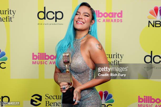 In this image released on May 23, Karol G, winner of the Top Latin Female Artist Award, poses backstage for the 2021 Billboard Music Awards,...