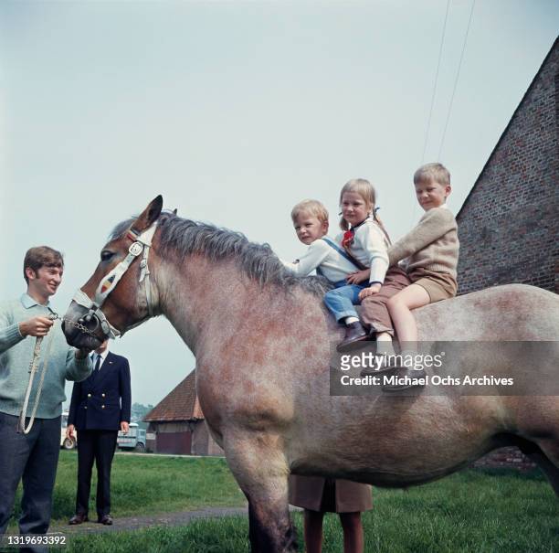 Belgian Royals Belgian Royals Prince Laurent of Belgium, Princess Astrid of Belgium and Prince Philippe of Belgium on a pony, being led by an...