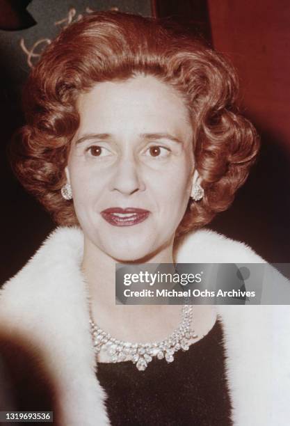 Belgian Royal Queen Fabiola of Belgium wearing a diamond necklace with a black outfit beneath a white fur stole, during an unspecified occasion,...