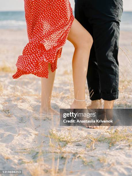 happy couple having fun on the beach. - beach vibes stock pictures, royalty-free photos & images