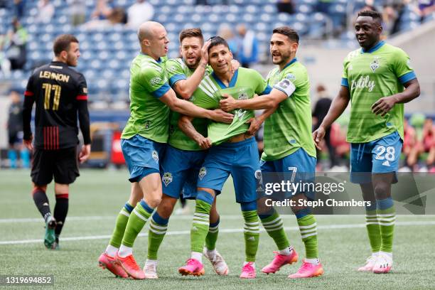 Raul Ruidiaz of Seattle Sounders celebrates his goal in the sixth minute against the Atlanta United at Lumen Field on May 23, 2021 in Seattle,...