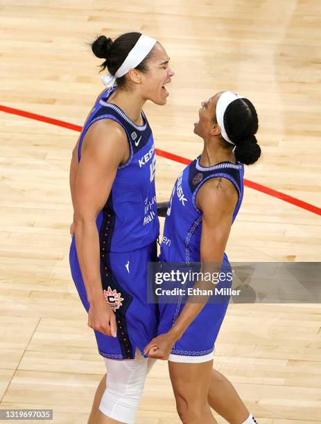 Brionna Jones and Jasmine Thomas of the Connecticut Sun celebrate on the court after Jones scored against the Las Vegas Aces and was fouled during...