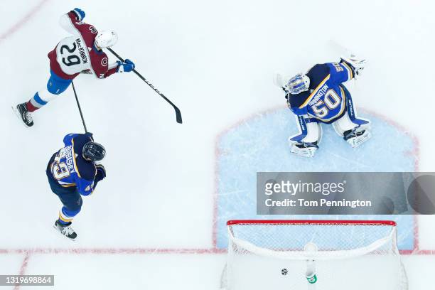 Nathan MacKinnon of the Colorado Avalanche scores a goal against Jordan Binnington of the St. Louis Blues in the third period at Enterprise Center on...
