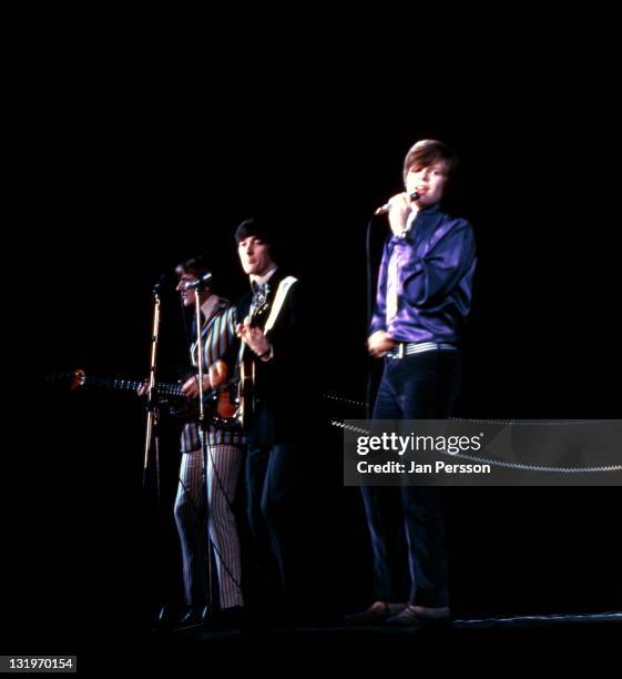 1st JANUARY: Herman's Hermits perform live on stage in Copenhagen, Denmark in January 1967. Left to right: bassist Karl Green, guitarist Keith...