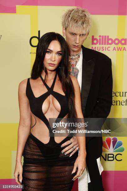 Pictured: Megan Fox and Machine Gun Kelly arrive to the 2021 Billboard Music Awards held at the Microsoft Theater on May 23, 2021 in Los Angeles,...