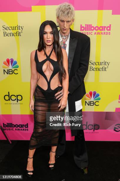 Megan Fox and Machine Gun Kelly poses backstage for the 2021 Billboard Music Awards, broadcast on May 23, 2021 at Microsoft Theater in Los Angeles,...