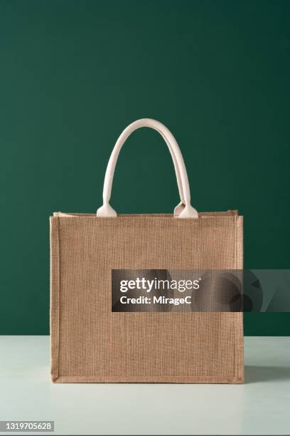 eco-friendly reusable jute shopping bag - tote bag stock pictures, royalty-free photos & images