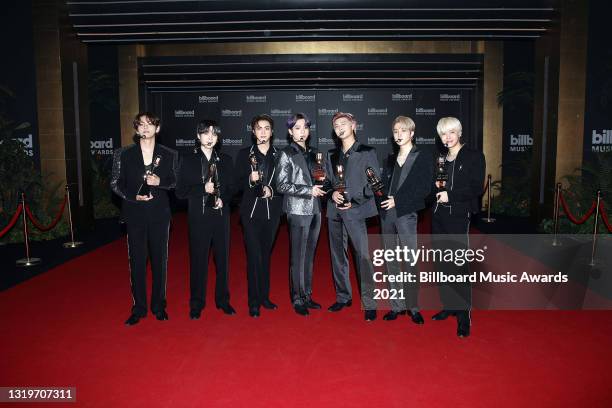 In this image released on May 23, V, Suga, Jin, Jungkook, RM, Jimin, and J-Hope of BTS, winners of the Top Selling Song Award for 'Dynamite,' pose...