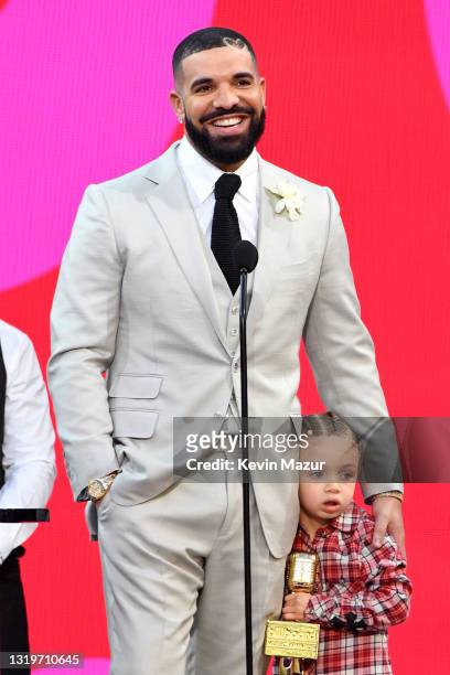 Drake, winner of the Artist of the Decade Award, and Adonis Graham speak onstage for the 2021 Billboard Music Awards, broadcast on May 23, 2021 at...