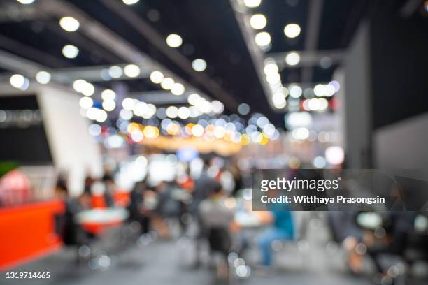 abstract blurred event with people for background - tradeshow stock-fotos und bilder